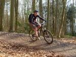 Women mountain biker on berm at Ashton Court.