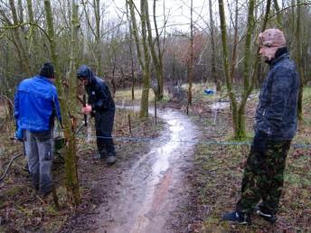 Marking out berm at mountain bike trail in Wiltshire.