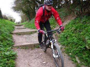 Cycling down a set of steps near Stonesfield.