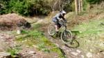 Woman riding the Ski Run downhill in the Forest of Dean.