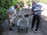 Loading chippings at mountain bike trail build day.