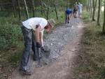 Resurfacing a mountain bike trail.