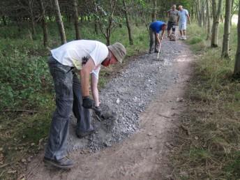 Resurfacing a mountain bike trail.