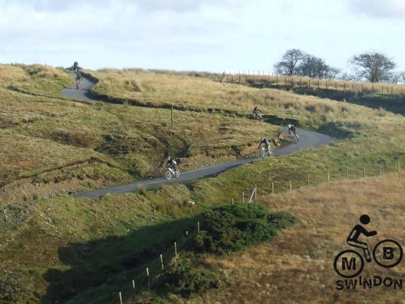 Cyclists on a hill in Wales.