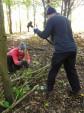 Building a wicker fence at mountain bike trail.