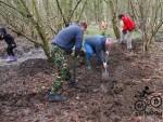 Digging a drainage ditch at a mountain bike trail.