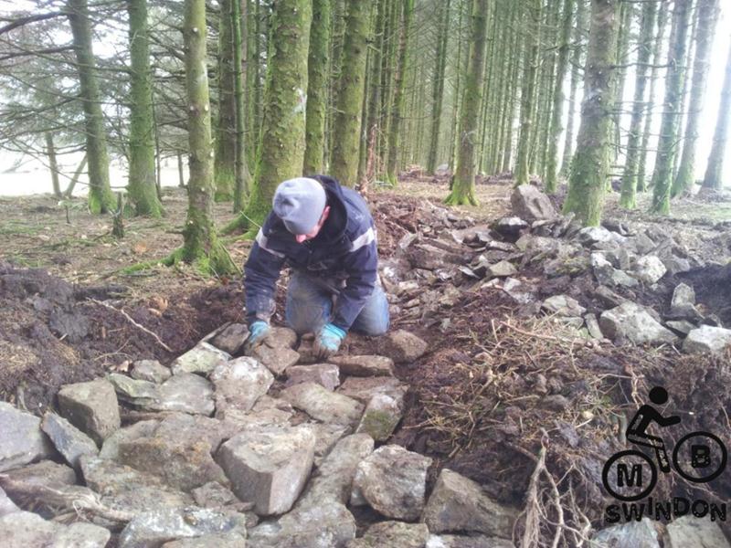 Laying rocks for a mountain bike trail.