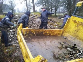 Shifting rocks at skills park build session.