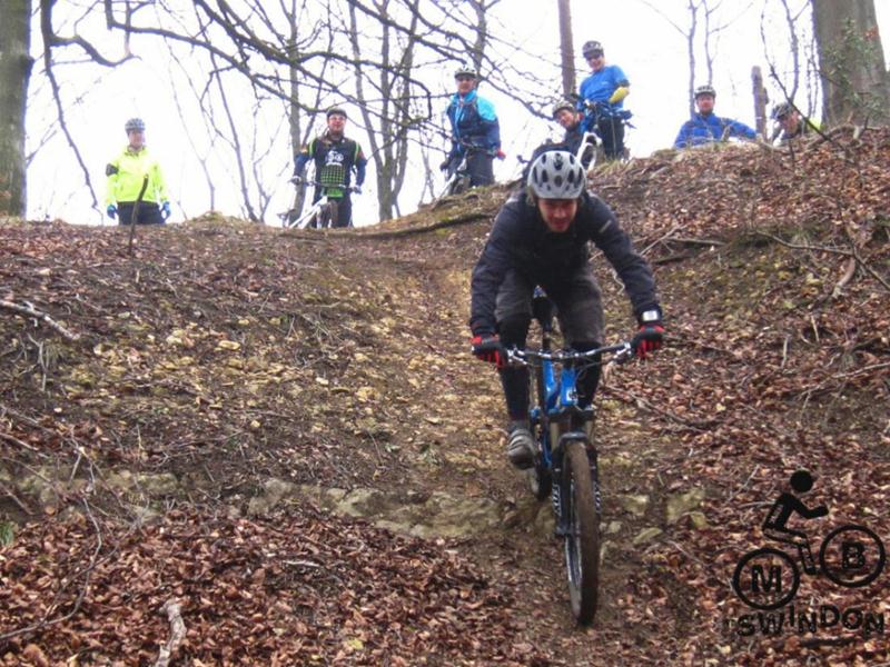 Riding down steep slope near Cranham