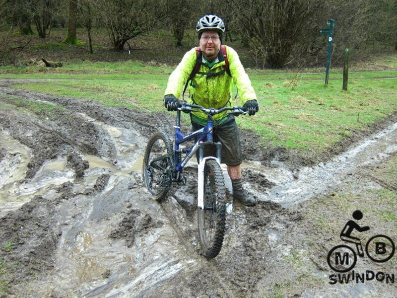 Muddy mountain biker near Walbury Hill