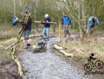 Log edging for mountain bike trail.