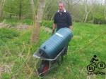 Water butt in a wheel barrow.